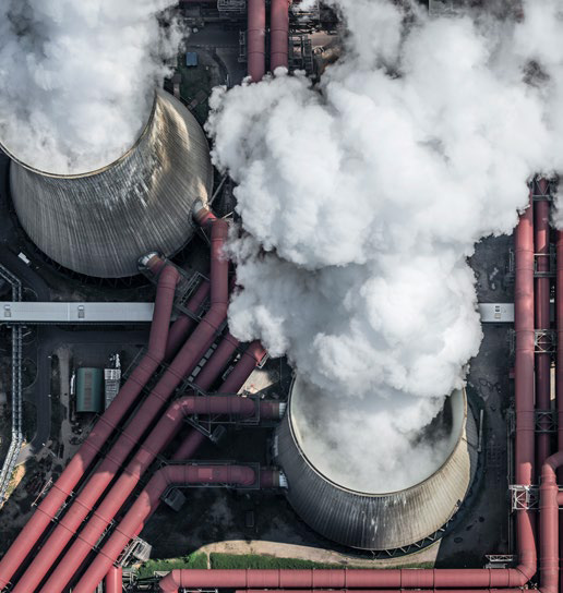 ariel view of power plant chimmneys in operation